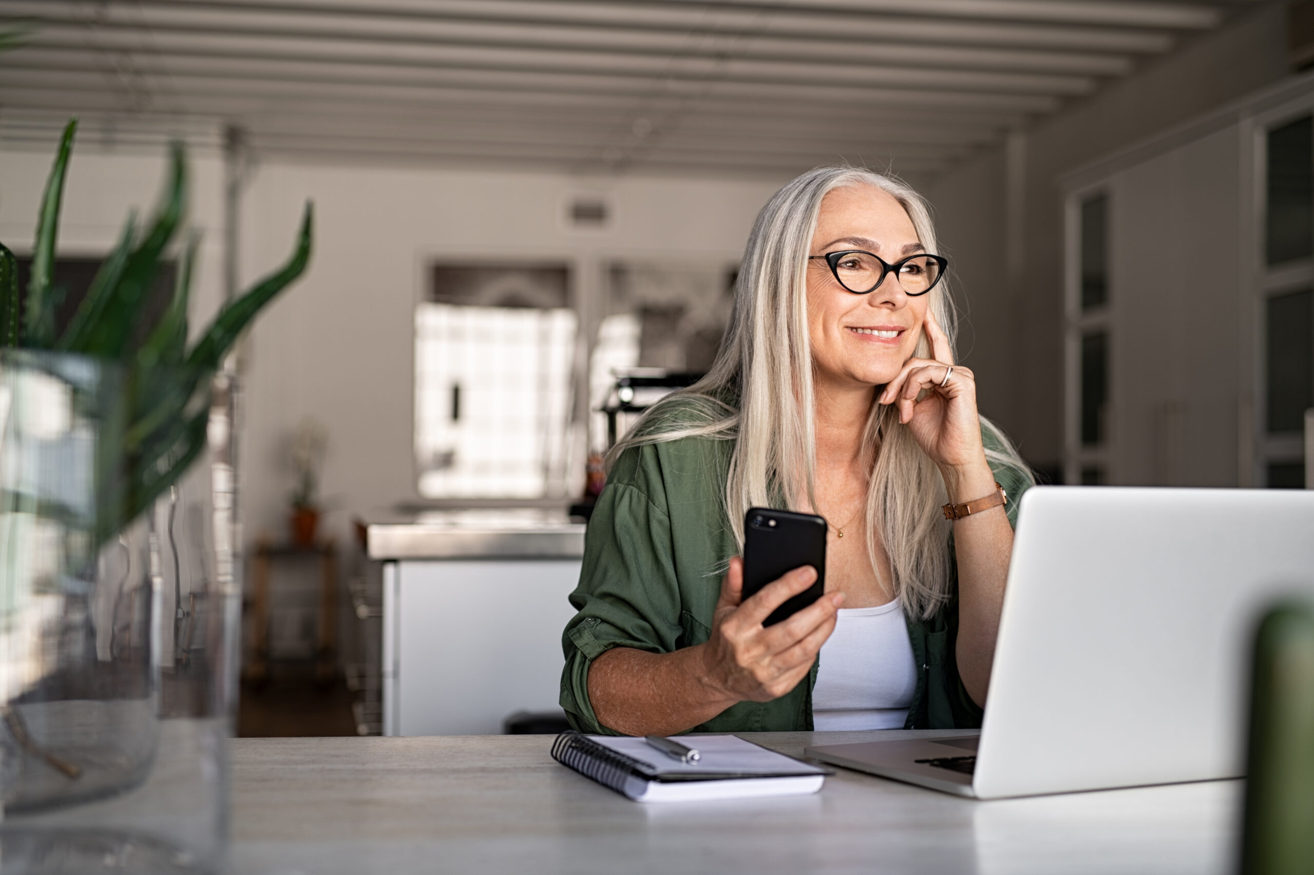 happy woman working at her business